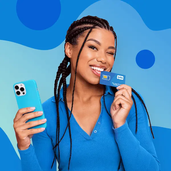 Woman with braided hair holding a Tello SIM card near her mouth and a phone in a blue case